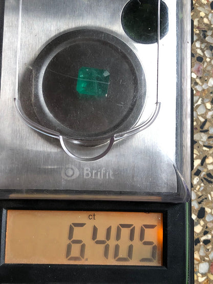 6.405 Carat Zambian Emerald on Weight Scale