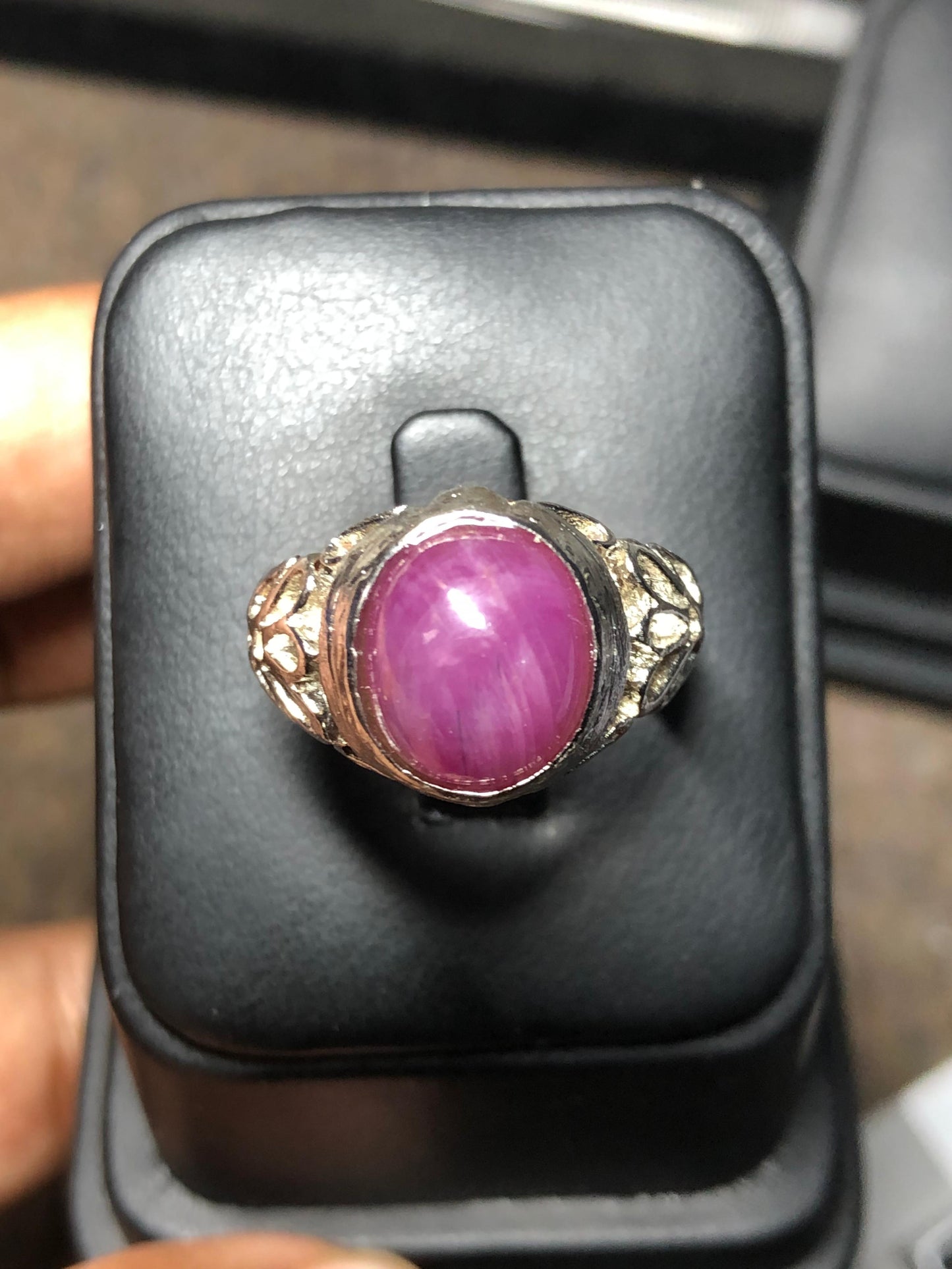 Oval ruby gemstone silver ring close up