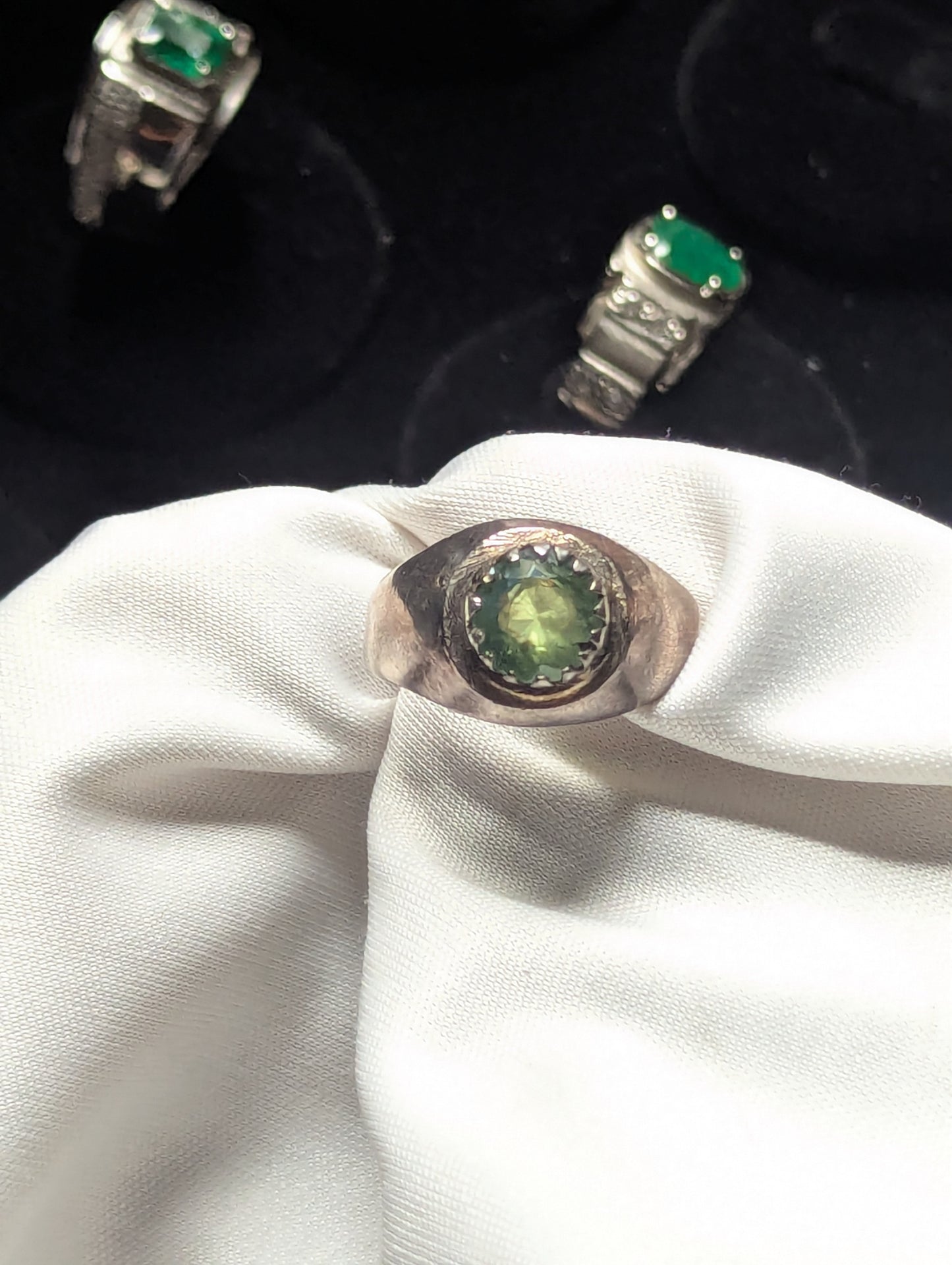 bezel set peridot men ring close up