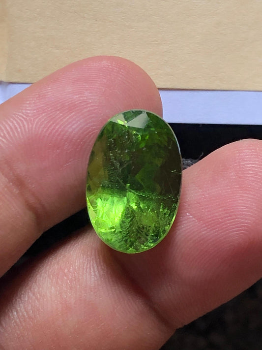 14.735 Carat Natural Peridot Gemstone – Oval Cut, Olive Green - Rutile Peridot gemstone